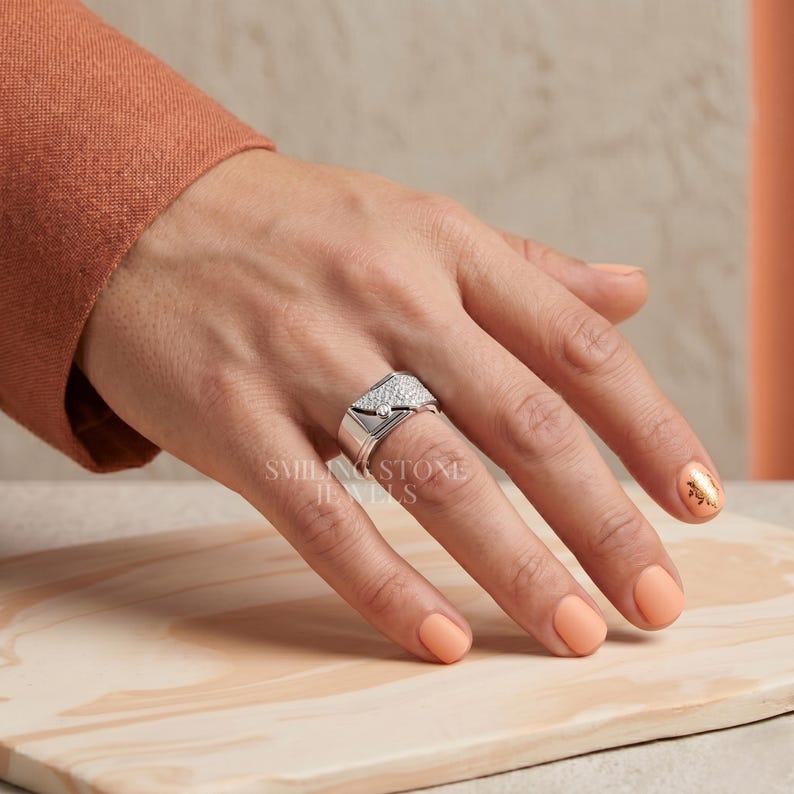 Men's Ring on hand showing True to Size fit. Finger shot of a wide white gold band. Women's ring alternative for a bold unisex statement style.