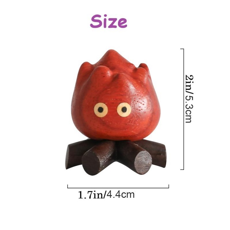 May include: A wooden, red-orange character with two round eyes and a flame-like head. The figure is 2 inches (5.3 cm) tall and 1.7 inches (4.4 cm) wide, resting on a base of wooden logs. The word "Size" is in the upper left corner.
