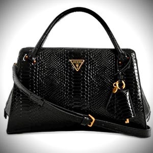 May include: Black handbag with a textured, snake-like pattern. Features a top handle, a detachable shoulder strap, and a gold-tone Guess logo. Includes a small charm and gold hardware accents.
