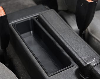 Compartimento de almacenamiento de la consola central del BMW E30: reemplazo del compartimento del casete