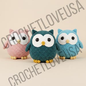 May include: Three crocheted owl figurines in pink, teal, and blue. Each owl has large white eyes with black pupils, a yellow beak, and yellow feet. The owls are handmade and have a textured appearance.