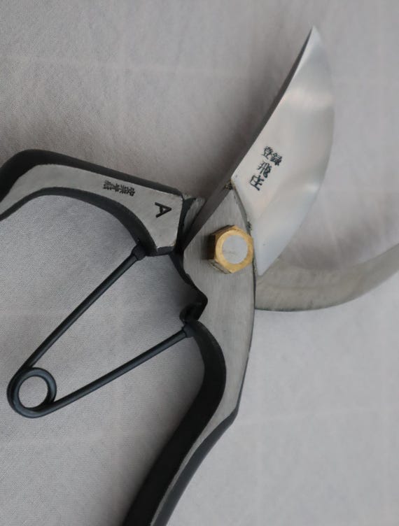 Hand-forged in Japan by Tobisho — a legendary Yamagata blacksmith — these secateurs are the kind of tool that gets handed down a generation, not tossed in a drawer.