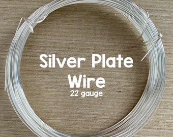 May include: A roll of silver plated wire, 22 gauge. The wire is coiled and ready to be used for jewelry making or other crafts.