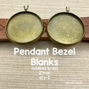 May include: Two 27mm oxidized brass pendant bezel blanks.  Pendant Bezel Blanks, oxidized brass, 27mm, qty: 2.  Avalon Beads.