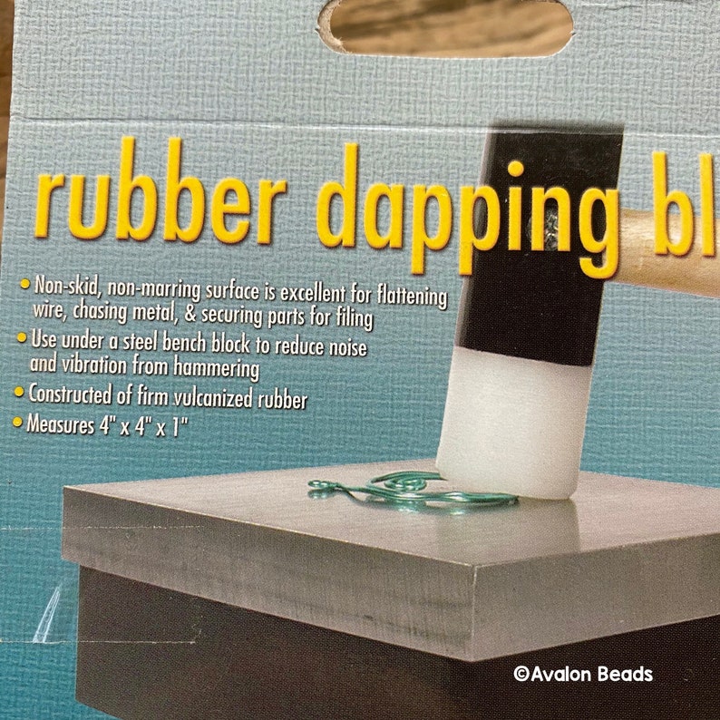 May include: A rubber dapping block with a non-skid surface, ideal for flattening wire and securing parts. The block measures 10.16 cm x 10.16 cm x 2.54 cm and is made of firm vulcanized rubber. The text "rubber dapping block" is visible.