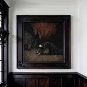 May include: A framed artwork depicting a dark, gothic scene. The image features a figure with a skeletal head and hands, kneeling on a wooden floor. The background includes a dark interior with a red, ominous curtain and a building silhouette.
