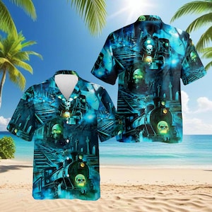 May include: Two short-sleeved button-down shirts with a spooky train design. The shirts feature a dark blue and teal color scheme with images of trains, skulls, and a spooky landscape. The shirts are displayed on a beach.