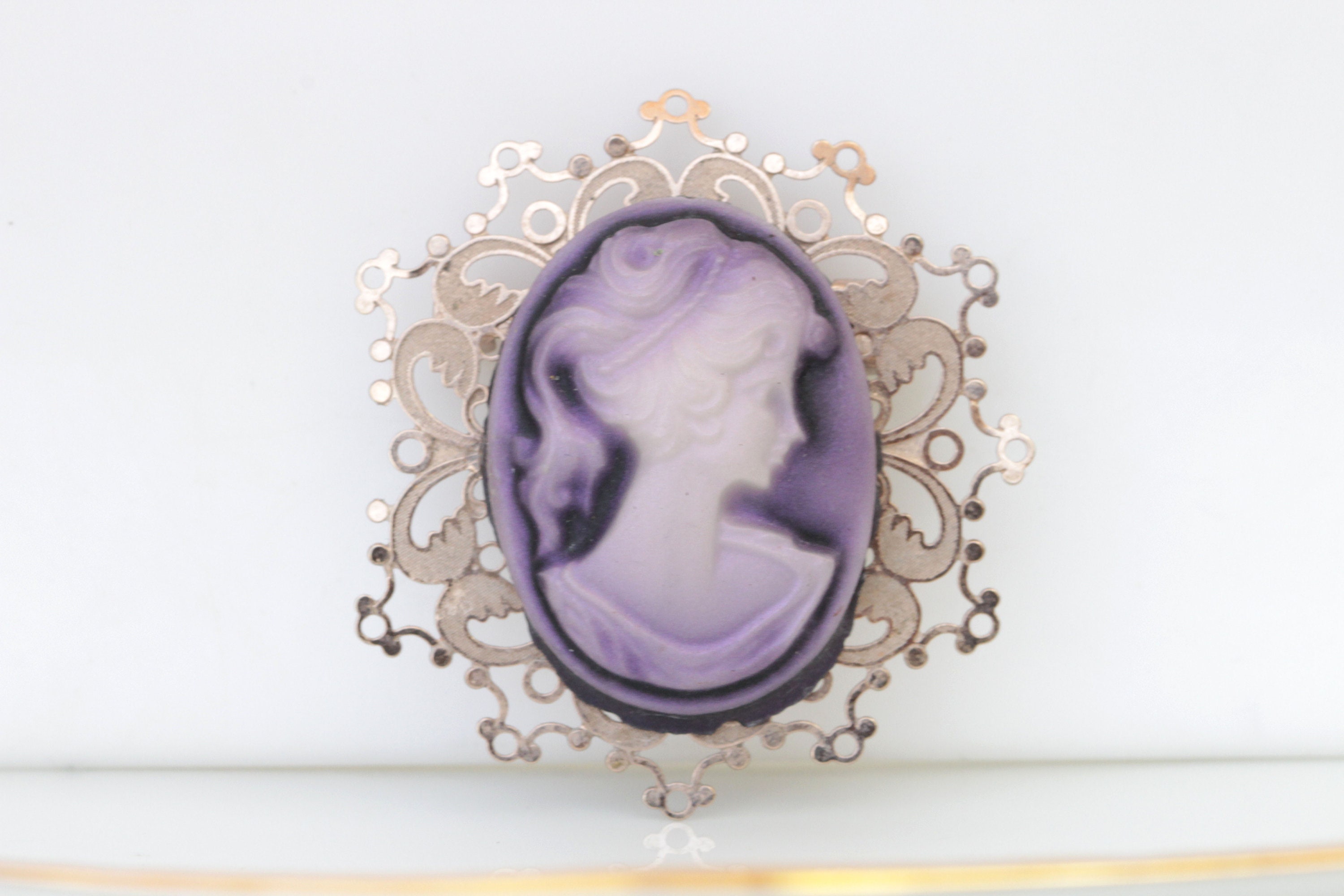 purple cameo brooch