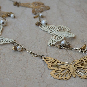 Butterfly shaped necklace. Pearl and enamel necklace. White pearl necklace. Long butterfly necklace. Gold white jewelry.  long necklace