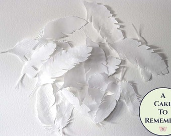 18 large edible wafer paper feathers in various shapes. Edible feathers for a unique wedding or birthday cake topper, or cupcake toppers