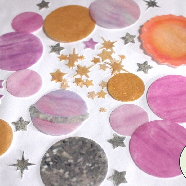 Precut edible pink and gold planets, sun and stars for First Trip Around the Sun party. Wafer paper outer space galaxy birthday cake ideas