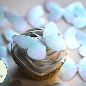 Ships fast   12 shimmery edible butterflies in pale unicorn colors. 2.25" Birthday cake topper for princess cupcakes and girl baby showers