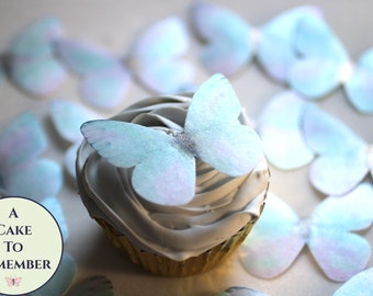 12 shimmery edible butterflies in pale unicorn colors. 2.25"  Butterfly birthday cupcake toppers for princess cakes and girl baby showers.