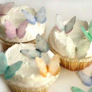 24 small pale pastels wafer paper edible butterflies for cake and cup.. 1.25" across, edible butterfly cupcake toppers set