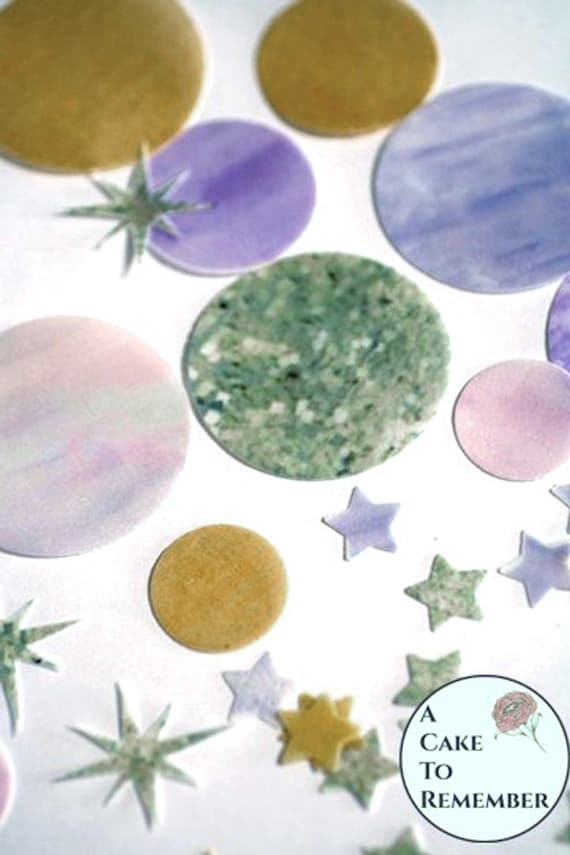 Precut edible pink and purple planets, sun and stars for First Trip Around the Sun party. Wafer paper outer space galaxy birthday cake ideas Il_570xn