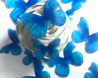 15 blue wafer paper edible butterflies for cake and cupcake toppers, assorted sizes. Blue butterfly decor for birthdays and baby showers