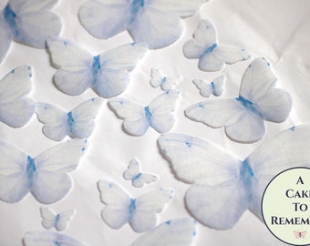16 pale pastel blue edible butterflies, wafer paper edible butterfly party decoration for cakes and cupcakes. Garden wedding cake topper