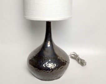 Metallic silver faceted ceramic lamp with linen shade