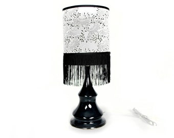 Black ceramic lamp with floral fringe shade