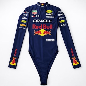 May include: A navy blue long-sleeved bodysuit with the Red Bull Racing logo and sponsor branding. The bodysuit has a high neckline and is adorned with logos in white, red, and yellow.