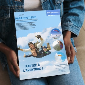 May include: A blue and white flyer with the word "PARACHUTISME" at the top. The flyer has images of people skydiving and the text "PARTEZ À L'AVENTURE !" at the bottom. The flyer is held by a person wearing a denim jacket.
