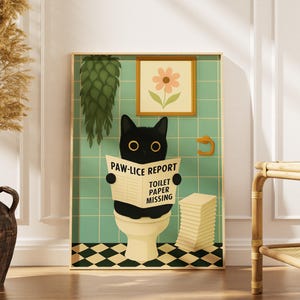 May include: A framed print featuring a black cat reading a newspaper titled "PAW-LICE REPORT" while sitting on a toilet. The background is a bathroom scene with a flower picture and a stack of toilet paper.