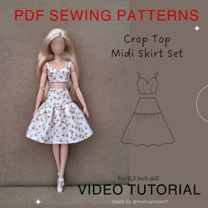 May include: A doll dressed in a white crop top and midi skirt set, adorned with a pink floral design. The image features the text "PDF Sewing Patterns", "Crop Top Midi Skirt Set", and "VIDEO TUTORIAL". The doll is approximately 29 cm tall.
