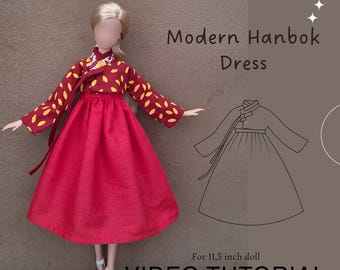 May include: A doll wearing a modern Hanbok dress. The dress features a red skirt and a maroon top with yellow leaf-shaped patterns. The image includes the text "PDF Sewing Patterns", "Modern Hanbok Dress", and "VIDEO TUTORIAL".
