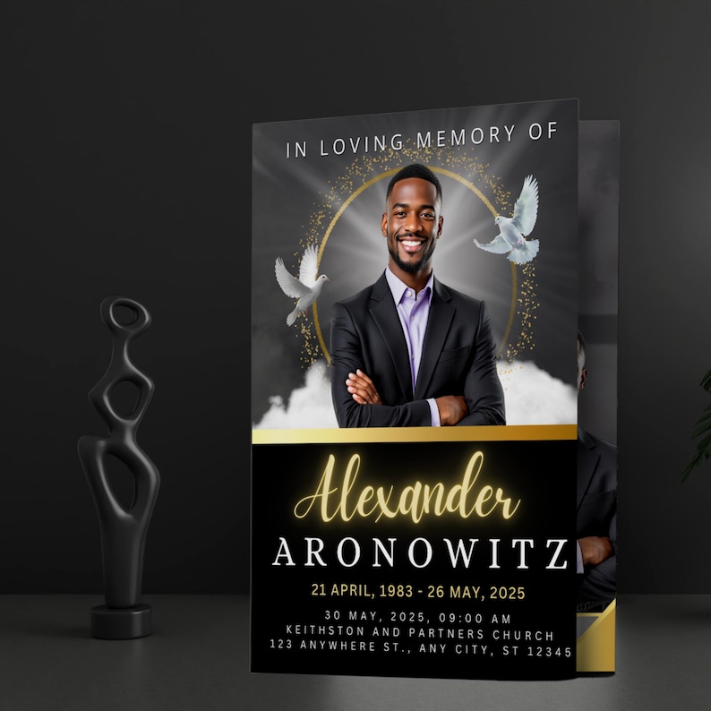 May include: A memorial card with a photo of a smiling man in a black suit. The card has gold accents and text that reads "In Loving Memory of Alexander Aronowitz" with dates and a church address.