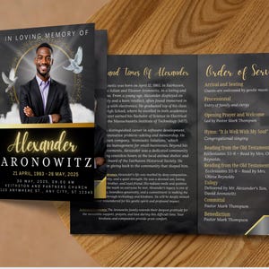 May include: A memorial service program with a portrait of a smiling man in a black suit. The program includes the name "Alexander Aronowitz", dates, and service details. The design features gold accents and doves.