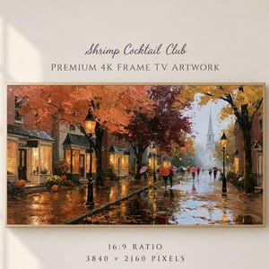 May include: Digital artwork titled Shrimp Cocktail Club Premium 4K Frame TV Artwork. The image depicts a rainy autumn street scene with orange trees, black lampposts, storefronts, and people with umbrellas walking toward a distant church steeple.