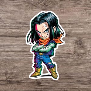 May include: A die-cut vinyl sticker featuring a stylized anime character with long black hair, wearing a purple vest over a green striped long-sleeve shirt, a bright orange neck scarf, blue distressed jeans, and gold boots with arms crossed.