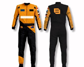 May include: Two racing suits, one facing forward and one from the back. The suits are primarily orange and black, with a white stripe across the chest and colorful accents on the shoulders. The front suit has an Australian flag patch.
