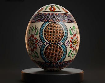 May include: A decorative egg with intricate floral and geometric patterns in red, blue, yellow, and green. The egg is displayed on a black stand against a dark background. The egg's design includes a woven-like pattern.