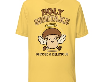 Maglietta con il simbolo del sacro shiitake / Divertente gioco di parole sui funghi / Angelo dei cartoni animati con il simbolo del sacro shiitake con lo slogan "Benedetto e delizioso"