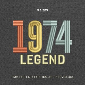 May include: An embroidered design on a dark gray background. The design features the year "1974" in orange, gold, and silver, with "LEGEND" below in gold. The text "9 SIZES" is at the top.