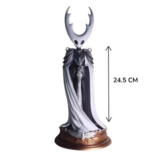 May include: A detailed figurine of a character with a white head and large horns, wearing a white cape and armor. The figure is 24.5 cm (9.6 inches) tall and stands on a decorative base with gold accents. The figure has a sword.