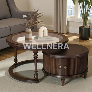 May include: A two-piece dark brown coffee table set. The larger table has a glass top with a white center and a decorative vase. The smaller table has a cabinet with vertical wood paneling and brass knobs. The tables are on a light-colored rug.