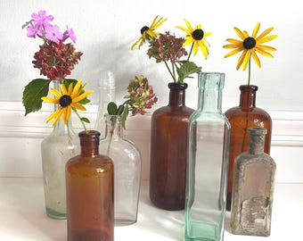 Antique glass apothecary glass bottles, set of 7