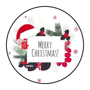 May include: A circular Christmas-themed design with a white background and a black border. The design features a red Santa hat, holly, berries, and the text "MERRY CHRISTMAS!". Decorative snowflakes and foliage complete the festive look.