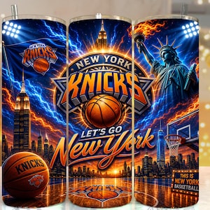 May include: A cylindrical tumbler featuring a New York Knicks basketball theme with the Statue of Liberty, the Empire State Building, a basketball, and the text New York Knicks and Let's Go New York against a dark blue and orange lightning background.