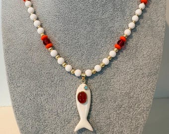 Colorful  beaded necklace with a white and red gem fish charm