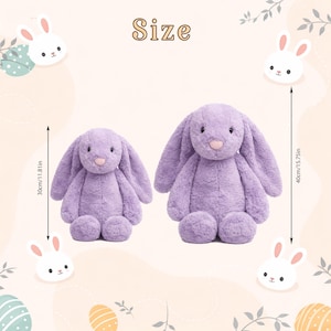 May include: Two plush lavender bunny rabbits. The smaller bunny is 11.81 inches tall, and the larger bunny is 15.75 inches tall. The bunnies have long floppy ears, pink noses, and are surrounded by decorative bunny and egg illustrations.