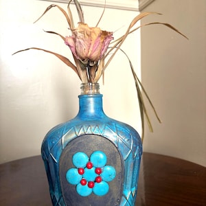 Hand painted recycled liquor bottle
