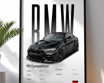 May include: Black framed print featuring a black BMW M2 Competition car. The print includes specifications: 3.0 L engine, 410 HP, 550 NM torque, and 1825 KG weight. The print also shows the car's 0-100 KM/H time and top speed.