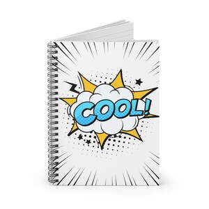 May include: White spiral notebook with a comic book style "COOL!" graphic. The design features a blue and white word bubble with the word "COOL!" in blue, outlined in white. The background has yellow starbursts and black lines.
