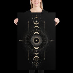 May include: A rectangular wall art print featuring a vertical arrangement of golden moon phases and celestial patterns against a solid black background. The design includes a central sunburst motif surrounded by concentric circles and fine geometric lines.