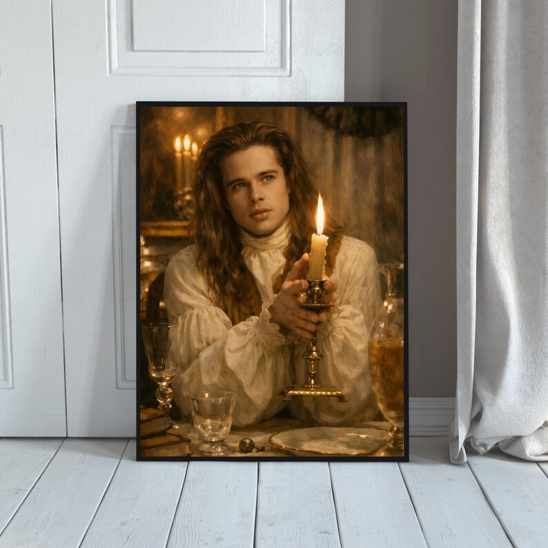 May include: Framed print featuring a portrait of a person with long hair, wearing a white ruffled shirt, holding a lit candle in a decorative holder. The image has a warm, vintage aesthetic with soft lighting and a blurred background.