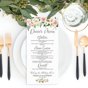 May include: A wedding menu card with a floral design. The menu includes starters, main course, dessert, and a thank you message for Isabelle & Andrew. The date is July 20, 2019.