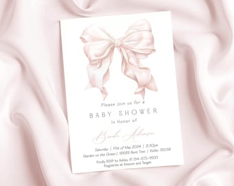 May include: A white rectangular baby shower invitation card featuring a large, soft pink watercolor bow illustration at the top. The text reads: Please join us for a BABY SHOWER In Honor of Brooke Adamson Saturday | 17th of May 2024 | 2:30pm Garden on the Green | 12689 Bent Tree | Keller 76038 Kindly RSVP to Ashley AT 214-673-9933 Registries at Amazon and Target.